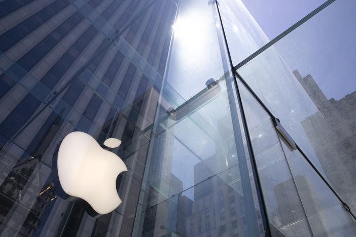In this June 16, 2020 file photo, the sun is reflected on Apple's Fifth Avenue store in New York.