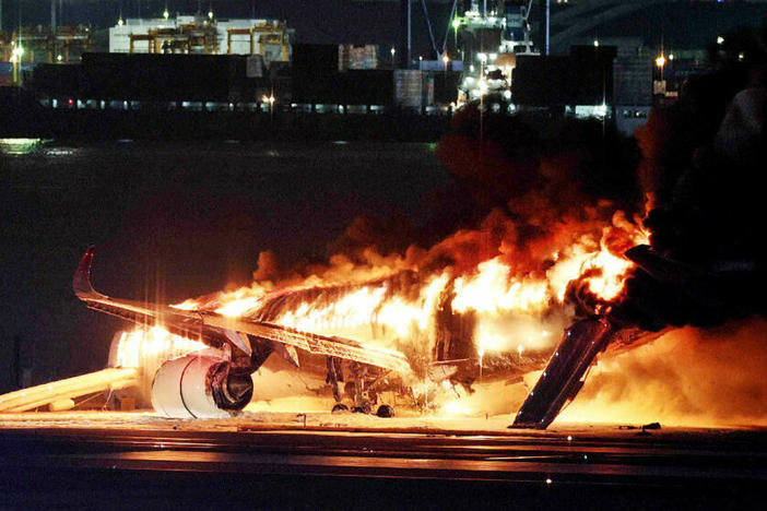 A Japan Airlines jet burst into flames after colliding with a Japanese coast guard plane at Tokyo's Haneda Airport in January. All 379 people on board the Japan Airlines flight were safely evacuated, but the incident raised questions about evacuation standards.