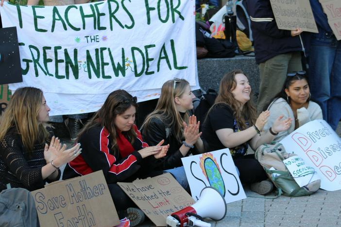 Ithaca residents called for officials to take action on climate change at a rally on Earth Day 2024.