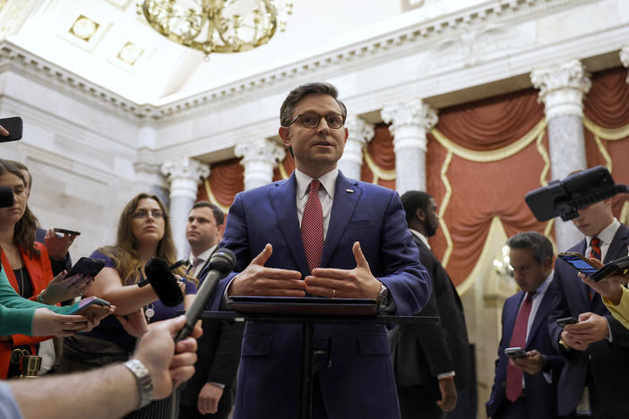 Speaker of the House Mike Johnson speaks with reporters in Statuary Hall after meeting with Reps. Marjorie Taylor Greene and Thomas Massie on May 6.