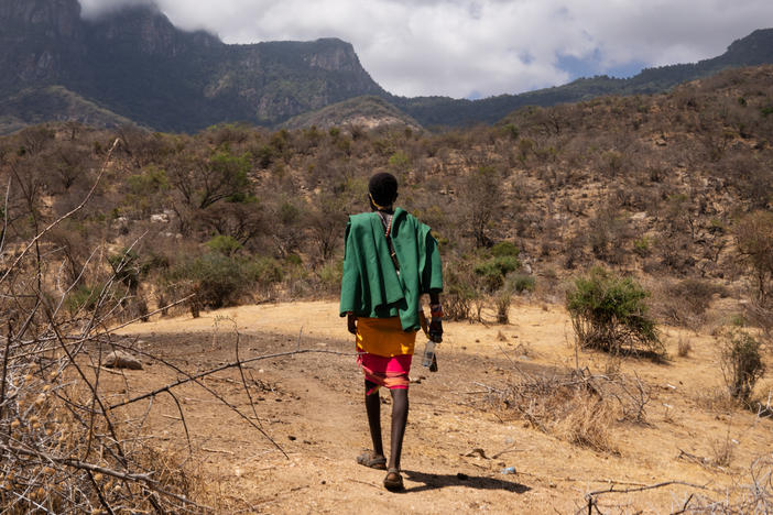 Ltesekwa Lekuuk, Paris's half-brother and a fellow moran, heads toward the mountain campsite where Paris had been living until a few weeks ago.