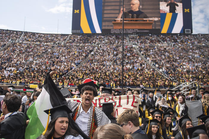 Graduates chant in support of Palestinians during the University of Michigan's commencement ceremony at Michigan Stadium in Ann Arbor on Saturday.