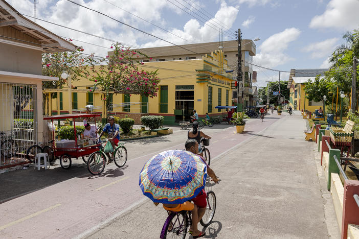 People cycle along the street in Afuá, a city in northern Brazil's Pará state, in January. <strong></strong>Since 2002, this city on the banks of the Amazon River has been famously off limits to motor vehicles.