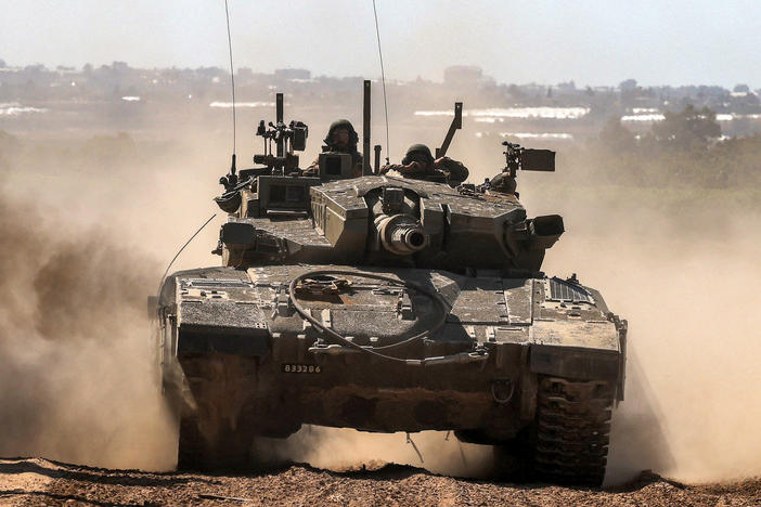 An Israeli army battle tank moves along the border with the Gaza Strip in southern Israel on May 7.