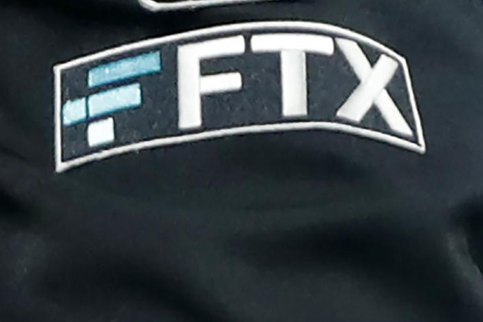 The FTX logo appears on home plate umpire Jansen Visconti's jacket at a baseball game with the Minnesota Twins on Sept. 27, 2022, in Minneapolis.