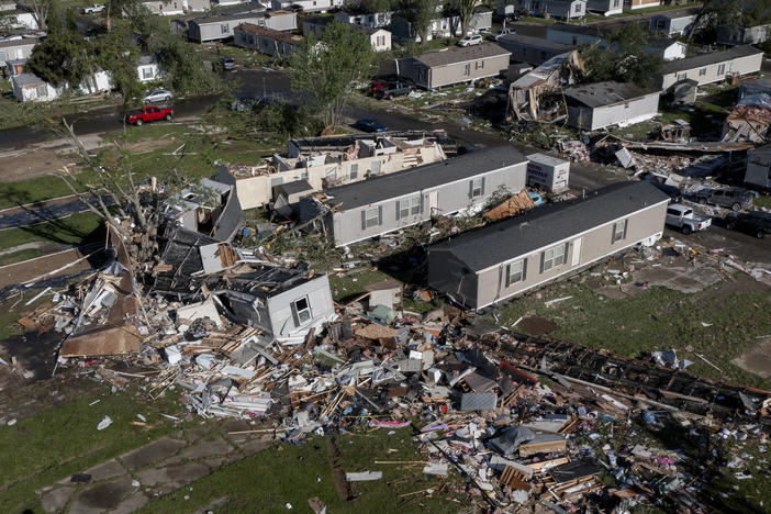 Storm damaged mobile homes are surrounded by debris at Pavilion Estates mobile home park just east of Kalamazoo, Mich., on Wednesday, May 8, 2024.