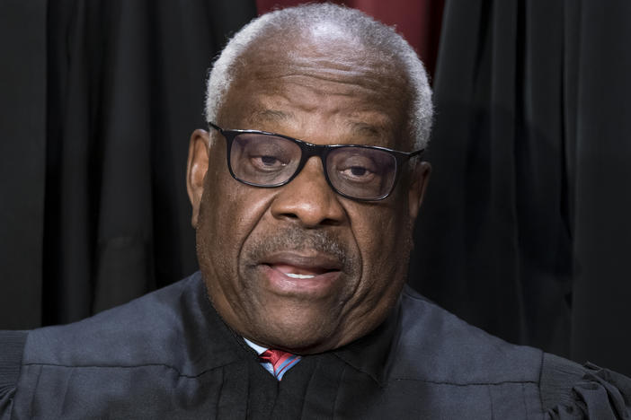 Justice Clarence Thomas poses for a photo at the Supreme Court building in Washington on Oct. 7, 2022. Thomas told attendees at a judicial conference Friday that he and his wife have faced "nastiness and lies" over the last several years. He also decried Washington, D.C., as a "hideous place."