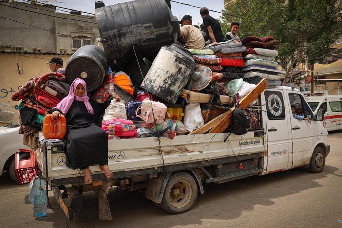 Palestinians pile their belongings on a vehicle as it drives to safer areas in Rafah, in the southern Gaza Strip, on Friday.