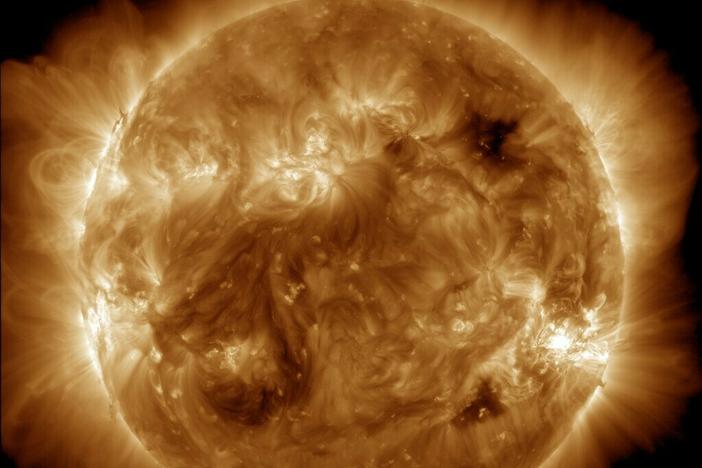 NASA's Solar Dynamics Observatory captured this image of solar flares early Saturday afternoon. The National Oceanic and Atmospheric Administration says there have been measurable effects and impacts from the geomagnetic storm.