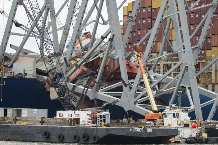 In this photo provided by the U.S. Army Corps of Engineers, salvors with the Unified Command prepare charges for upcoming precision cuts to remove Section 4 from the port side of the bow of the Dali container ship, May 7, 2024, during the Key Bridge Response, in Baltimore.