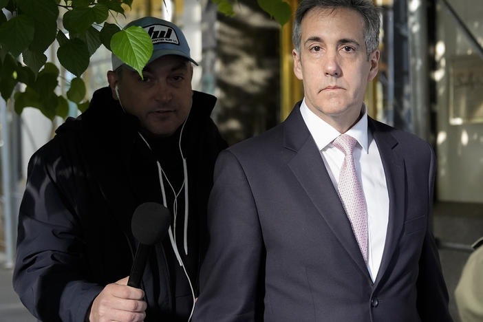 Michael Cohen leaves his apartment building on his way to Manhattan criminal court on Monday.