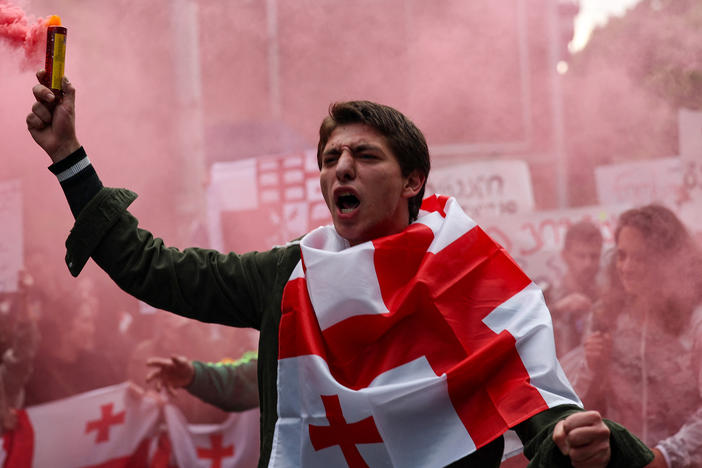 The Georgian parliament is scheduled to vote on the controversial law on Tuesday. Here, a demonstrator on Monday in Tbilisi, Georgia.