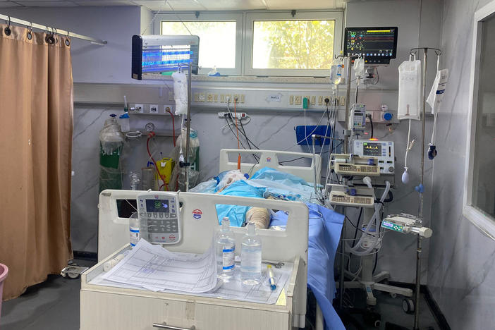 A patient in European Gaza hospital this weekend — the last functioning hospital in Rafah. Staff placed an insect zapper above his bed to keep away the flies.