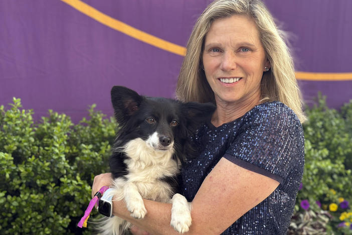 Cynthia Hornor poses with Nimble, the first mixed-breed dog ever to win the Westminster Kennel Club dog show's agility competition, in New York on Monday.