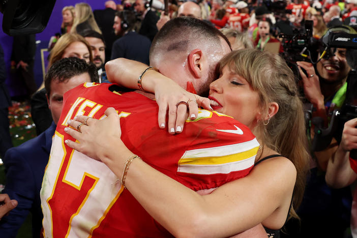 Travis Kelce of the Kansas City Chiefs embraces Taylor Swift after defeating the San Francisco 49ers during this year's Super Bowl in Las Vegas. Swift, who flew in from Tokyo to attend the game, jokingly told him, "jet lag is a choice."