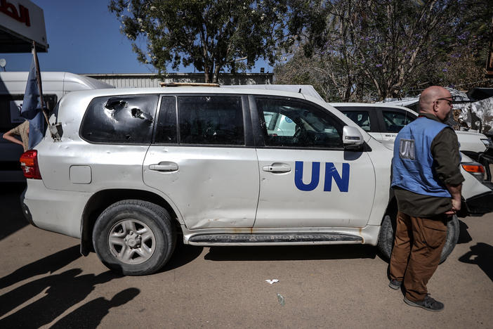 A damaged United Nations vehicle is seen in front of a hospital in the Gaza Strip after a U.N. employee was killed in an attack on Monday.