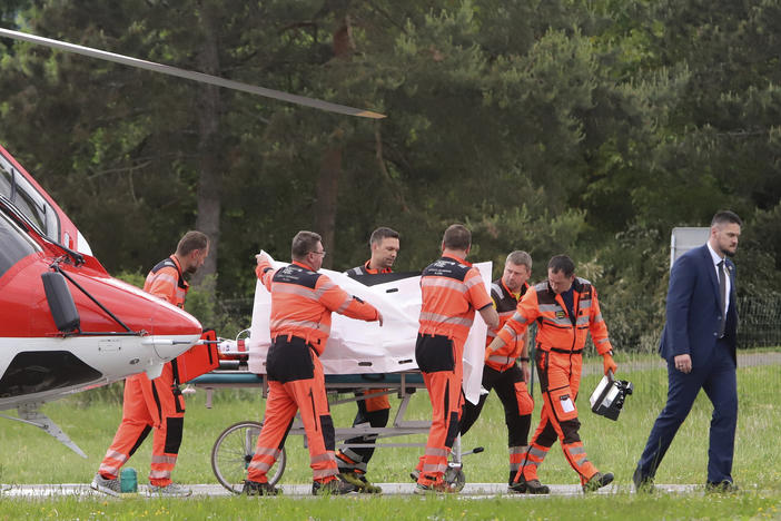 Rescue workers wheel Slovak Prime Minister Robert Fico, who was shot and injured, to a hospital in the town of Banska Bystrica, central Slovakia, on Wednesday.