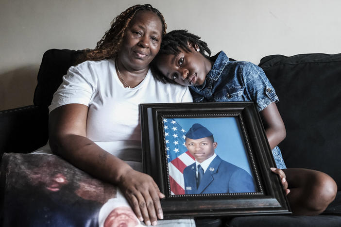 Chantemekki Fortson, mother of Roger Fortson, a U.S. Air Force senior airman, holds a photo of her son.
