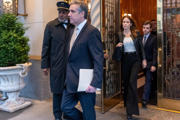 Michael Cohen, former personal lawyer to former President Donald Trump, and attorney Danya Perry leave his apartment building on his way to Manhattan Criminal Court in New York City on Thursday.