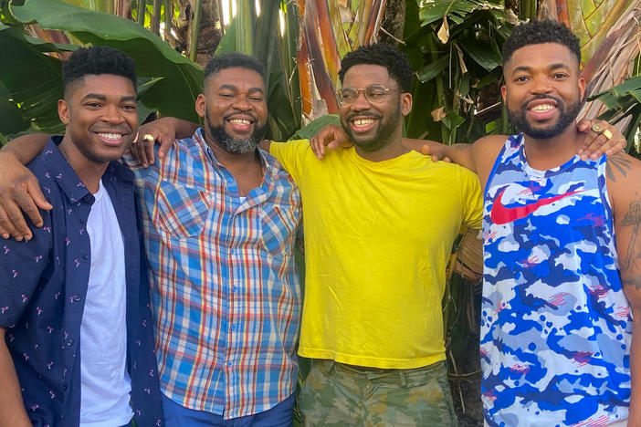 Honoré Prentice (in yellow shirt and glasses), who lives in Canada, met three of his birth siblings, who live in the U.S., in person on Dec. 13, 2021. The brothers were all born in Haiti.