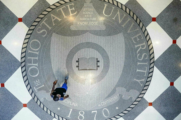 Pedestrians pass through The Ohio State University's student union.