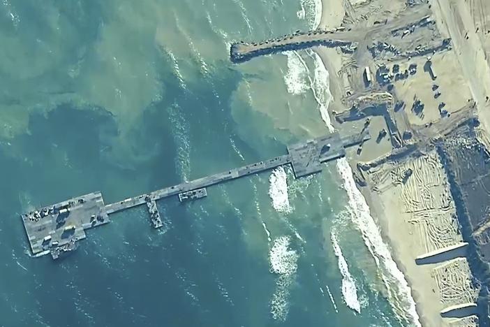 The image provided by U.S, Central Command, shows U.S. Army soldiers, U.S. Navy sailors and Israel Defense Forces placing the Trident Pier on the coast of Gaza Strip on Thursday.