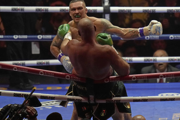Ukraine's Oleksandr Usyk launches an attack on Britain's Tyson Fury during their undisputed heavyweight world championship boxing fight at the Kingdom Arena in Riyadh, Saudi Arabia, Sunday, May 19, 2024.