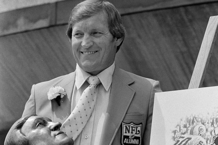 Jim Otto, former center for the Oakland Raiders, poses with his bust after enshrinement in the in the Pro Football Hall of Fame in Canton, Ohio, Aug. 2, 1980.