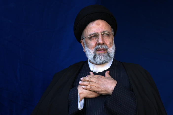 Iranian President Ebrahim Raisi is shown placing his hands on his heart as a gesture of respect to the crowd during the funeral ceremony of the victims of a bomb explosion in the city of Kerman, Iran, on Jan. 5, 2024.