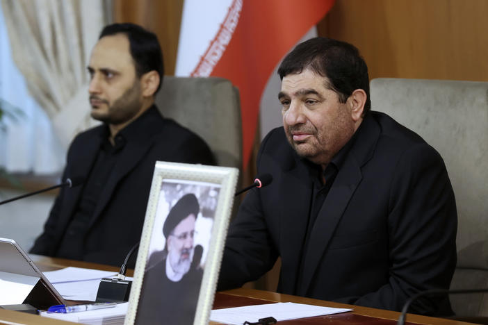 In this photo released by the Iranian first vice president's office, Iranian First Vice President Mohammad Mokhber, right, now acting President of the Islamic Republic of Iran, leads a cabinet meeting in Tehran on Monday.