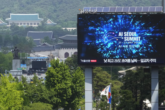 A screen shows an announcement of the AI Seoul Summit in Seoul, South Korea, on Tuesday.