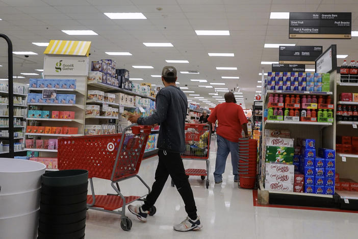 Customers shop at a Target store on Monday in Miami.