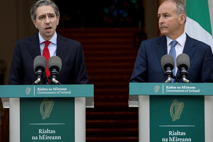 Ireland's Prime Minister Simon Harris (left), flanked by Ireland's Minister of Foreign Affairs Micheál Martin, speaks Wednesday in Dublin to announce Ireland's recognition of a Palestinian state.