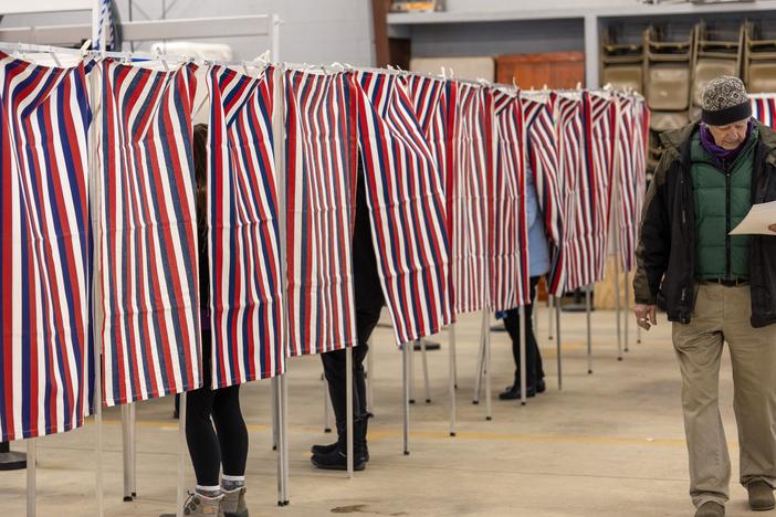 Voters filling out their ballots on Jan. 23 in Loudon, N.H. A political consultant faces charges in New Hampshire and steep fines from the Federal Communications Commission for creating a robocall ahead of that state's presidential primary featuring a cloned version of President Biden's voice, urging people not to vote in the primary.