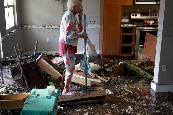 Hurricane Ian killed more than 150 people when it slammed into Florida in 2022. Here, Fort Myers, Fla., resident Stedi Scuderi looks over her apartment after it was inundated by flood water from the storm.