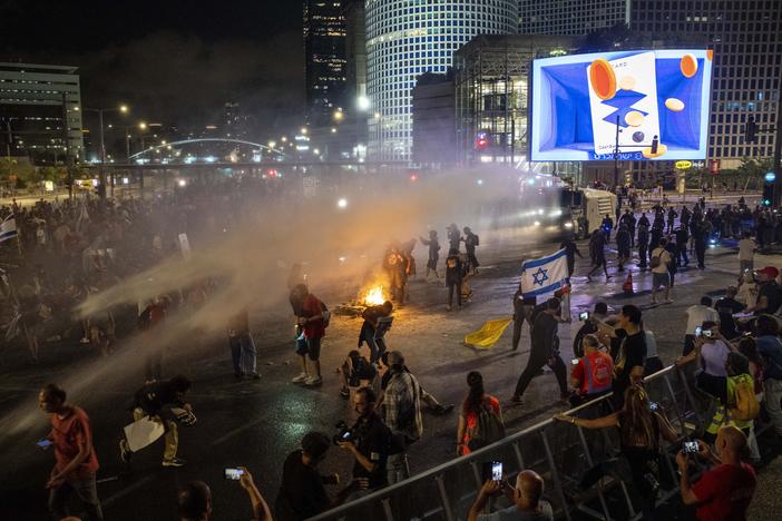 Police use water cannon to disperse demonstrators during a protest against Israeli Prime Minister Benjamin Netanyahu's government, and calling for the release of hostages held in the Gaza Strip by the Hamas militant group, in Tel Aviv, Israel, Saturday, May 25, 2024.