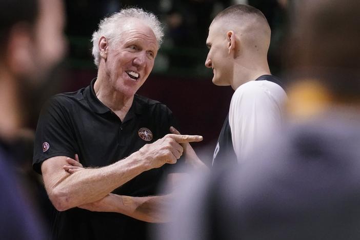Basketball Hall of Fame legend Bill Walton, left, jokes with Denver Nuggets center Nikola Jokic in February 2022 during a practice session for the NBA All-Star basketball game in Cleveland. Walton, who starred for John Wooden's UCLA Bruins before becoming a Basketball Hall of Famer and one of the biggest stars of basketball broadcasting, died Monday, the league announced on behalf of his family. He was 71.