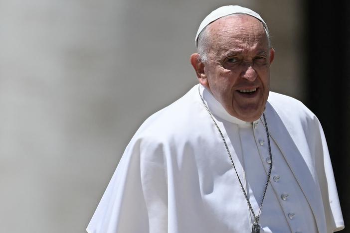 Pope Francis leaves a mass on World Children's Day at St Peter's Basilica in the Vatican on May 26.