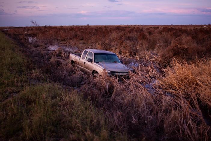  A truck sits in still water after Hurricane Laura swept through Cameron Parish, La., in 2020. The storm killed dozens of people in the U.S.