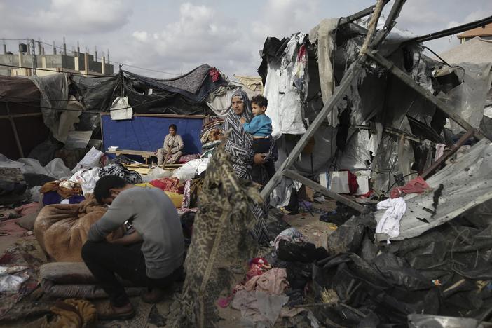 Displaced Palestinians inspect their tents destroyed by Israel's bombardment, adjunct to an UNRWA facility west of Rafah city, Gaza Strip, Tuesday, May 28, 2024.