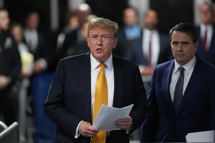 Former U.S. President Donald Trump with attorney Todd Blanche speaks to the media during his trial for allegedly covering up hush money payments, at Manhattan Criminal Court on Tuesday in New York City.