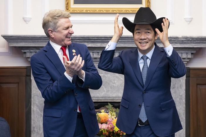 In this photo released by the Taiwan Presidential Office, Taiwan President Lai Ching-te, right, puts on a cowboy hat given by Rep. Michael McCaul, R-Texas, during a Monday meeting in Taipei, Taiwan. A U.S. congressional delegation met Taiwan's new leader on Monday in a show of support shortly after China held drills around the self-governing island in response to his inauguration speech. 