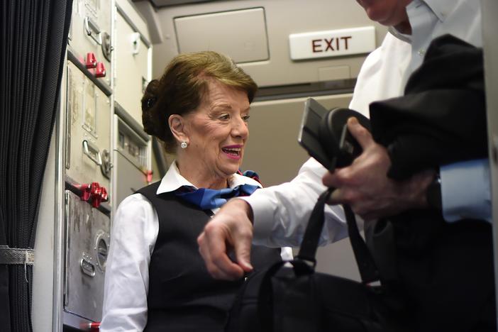 American Airlines flight attendant Bette Nash greets passengers disembarking from her daily return flight to Boston at Reagan Washington Airport in 2017, at age 81. She died earlier this month.