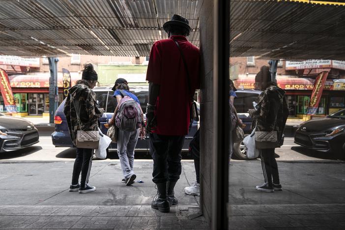 People gather outside the Savage Sisters' community outreach storefront in the Kensington neighborhood of Philadelphia. The area is being hit hard by Medetomidine and Xylazine, powerful sedatives most often used by veterinarians that are moving through the illicit drug supply triggering "mass overdose" events and causing gruesome skin wounds. 