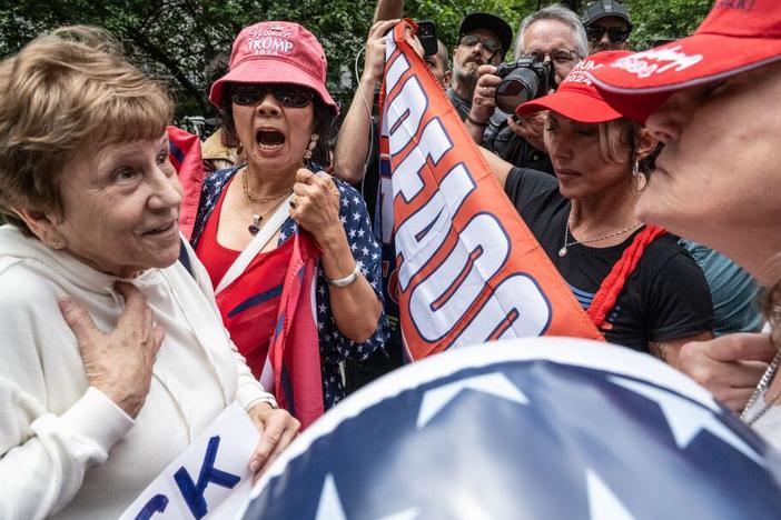 Trump supporters and their opponents spar outside of the criminal court where the former president is on trial on Wednesday in New York City. 