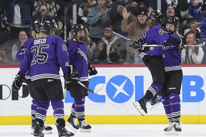 Minnesota forward Michela Cava, middle right, celebrates with defender Abby Cook, right, and teammates after scoring during the second period of a PWHL hockey game against Montreal on Wednesday night in St. Paul, Minn.