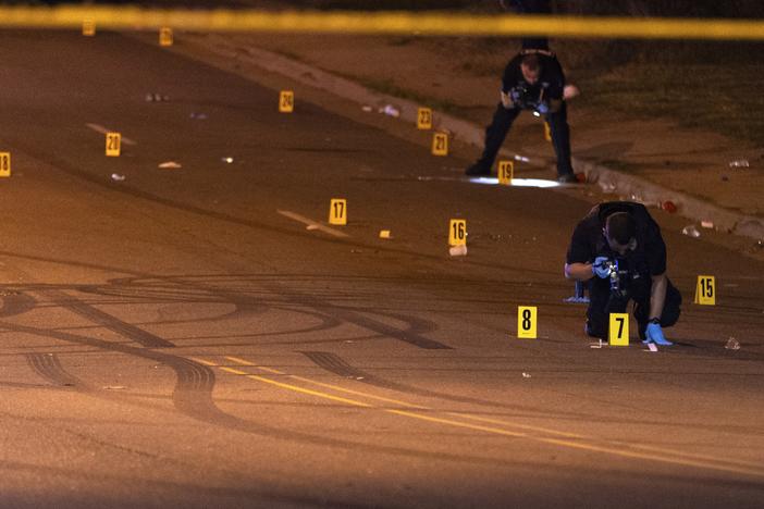 This image, courtesy of News 5 Cleveland, shows officers of the Akron Police Department investigating a shooting that happened overnight in Akron, Ohio, on Sunday.
