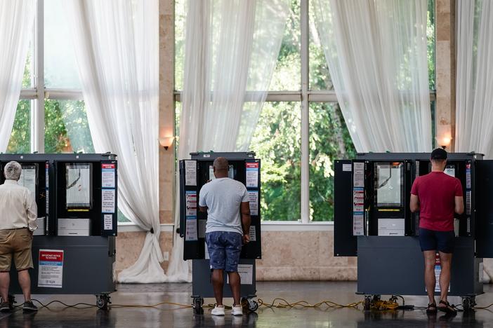 Voters cast ballots in Georgia's primary election at a polling location on May 21, 2024 in Atlanta. Many officials and researchers worry that audio deepfakes of politicians could be used to sway elections this year. 
