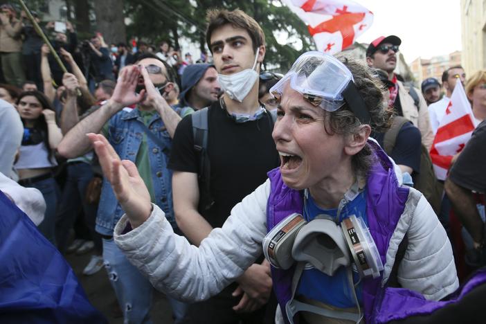 A demonstrator argues with police officers during a protest against the foreign influence bill at the Parliamentary building in Tbilisi, Georgia, on Tuesday, May 28, 2024. The Georgian parliament has overridden a presidential veto of the "foreign agents" legislation that has fueled Western concerns and sparked massive protests for weeks.