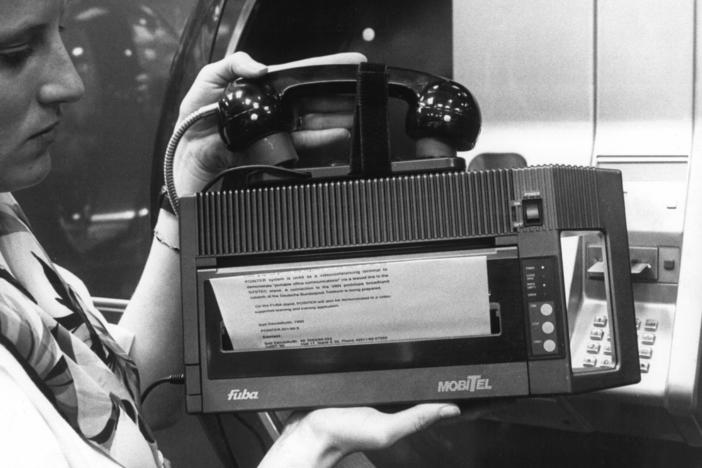 The CeBit technology fair in Hanover, Germany, March 24, 1990, shows a portable fax machine that weighs 3 kilos (6.6 pounds) and can be connected to any telephone via acoustic couplers.